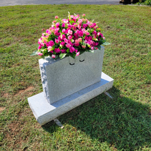 Load image into Gallery viewer, This Headstone Saddle has grave flowers including Beauty Pink Mini Mums. It is a perfect funeral or cemetery decoration.
