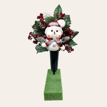 Load image into Gallery viewer, This cemetery cone pair comes with a cute smiling snowman, red berries, and a stocking cap. It is 2 Christmas memorial decorations.