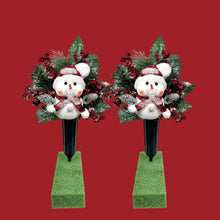 Load image into Gallery viewer, This cemetery cone pair comes with a cute smiling snowman, red berries, and a stocking cap. It is 2 Christmas memorial decorations.