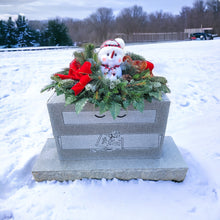Load image into Gallery viewer, This Chubby Snowman Christmas cemetery saddle has greenery and a red velvet bow. It is a winter memorial decoration.