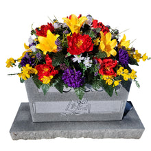 Load image into Gallery viewer, This is a Headstone Saddle with Trumpet Lillies, Peonies, mums, and delphinium. It is a memorial arrangement for a funeral or cemetery.