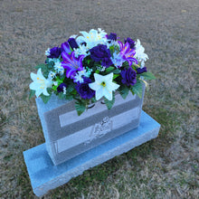 Load image into Gallery viewer, Headstone Saddle with purple & white trumpet lilies and purple roses. It is a grave flower cemetery, funeral, or memorial decoration.
