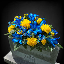 Load image into Gallery viewer, This Headstone Saddle has grave flowers including Vibrant Blue Trumpet Lilies, Bright Yellow Mums, & Rosebuds. It is a memorial decoration.