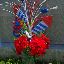 Load image into Gallery viewer, This patriotic cemetery cone memorial decoration has grave flowers including red geranium and red, white, and blue stars & fireworks.