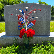 Load image into Gallery viewer, This patriotic cemetery cone memorial decoration has grave flowers including red geranium and red, white, and blue stars & fireworks.