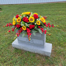 Load image into Gallery viewer, This Headstone Saddle is made with grave flowers including sunflowers and geraniums. It&#39;s a memorial decoration..
