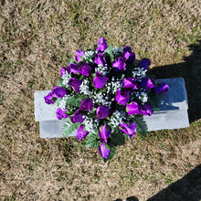 Load image into Gallery viewer, Headstone saddle with purple rosebud grave flowers. It is a funeral, cemetery, or memorial decoration.
