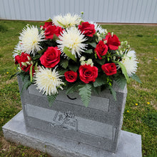 Load image into Gallery viewer, A headstone saddle with red roses and cream mum grave flowers for cemetery, funeral, and memorial decorations.
