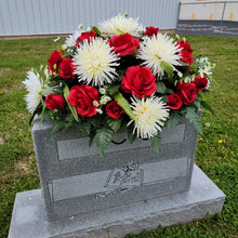 Load image into Gallery viewer, A headstone saddle with red roses and cream mum grave flowers for cemetery, funeral, and memorial decorations.
