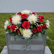 Load image into Gallery viewer, A headstone saddle with red roses and cream mum grave flowers for cemetery, funeral, and memorial decorations.
