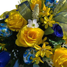 Load image into Gallery viewer, Spring Headstone Saddle has blue, yellow, &amp; cream faux silk rose and calla lily grave flowers with floral print Easter eggs and ribbon.
