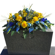 Load image into Gallery viewer, Spring Headstone Saddle has blue, yellow, &amp; cream faux silk rose and calla lily grave flowers with floral print Easter eggs and ribbon.
