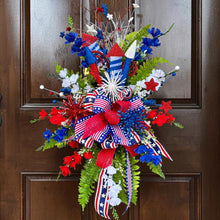 Load image into Gallery viewer, Glitzy Patriotic Front Door Swag--Red, White, and Blue with semi quincentennial decor with fireworks, rockets, and flashy Bow
