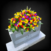 Load image into Gallery viewer, This Headstone Saddle has grave flowers including Multi-Colored Mini Mums. It is a perfect funeral or cemetery decoration.
