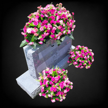 Load image into Gallery viewer, This is a Headstone Saddle with cemetery cones; it has grave flowers including Beauty Pink Mini Mums.
