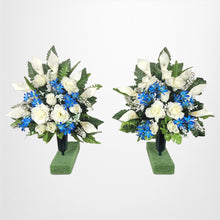 Load image into Gallery viewer, This cemetery cone pair has grave flowers including Cream Calla Lilies &amp; Roses with royal blue filler. It is a perfect memorial decoration.
