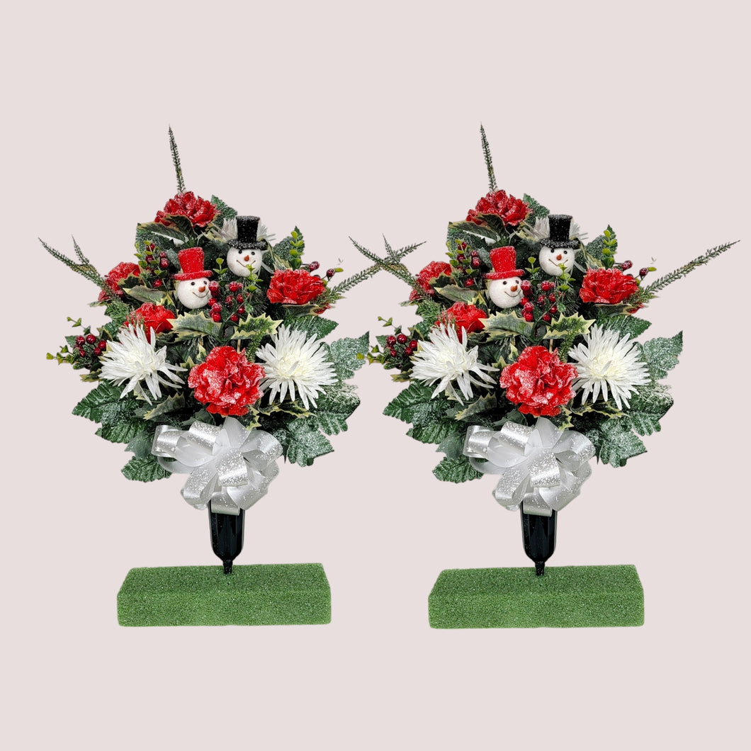 This cemetery cone pair has Red & White carnations and mums grave flowers with snowman accents.