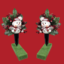 Load image into Gallery viewer, This cemetery cone pair comes with a cute smiling snowman, red berries, and a stocking cap. It is 2 Christmas memorial decorations.
