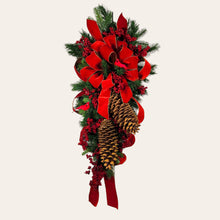 Load image into Gallery viewer, This is a teardrop door hanging that is festive for the Christmas season. It has pinecones, berries, pine, and a cardinal.
