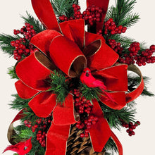 Load image into Gallery viewer, This is a teardrop door hanging that is festive for the Christmas season. It has pinecones, berries, pine, and a cardinal.
