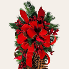 Load image into Gallery viewer, This is a teardrop door hanging that is festive for the Christmas season. It has pinecones, berries, pine, and a cardinal.
