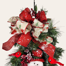 Load image into Gallery viewer, This is a teardrop door hanging that is festive for the Christmas season. It has a snowman, berries, cardinals, and 2 holiday bows.
