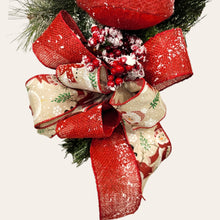 Load image into Gallery viewer, This is a teardrop door hanging that is festive for the Christmas season. It has a snowman, berries, cardinals, and 2 holiday bows.
