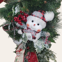 Load image into Gallery viewer, This is a teardrop door hanger that is a festive swag for Christmas season. It has berries, pinecone, snowballs, cute snowman, and a bow.
