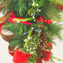 Load image into Gallery viewer, This is a teardrop door hanger festive swag for Christmas season. It has red &amp; blue berries, pinecones, cardinals, and red velvet ribbon.
