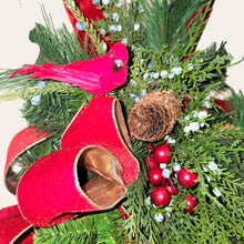 Load image into Gallery viewer, This is a teardrop door hanger festive swag for Christmas season. It has red &amp; blue berries, pinecones, cardinals, and red velvet ribbon.
