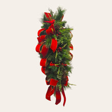 Load image into Gallery viewer, This is a teardrop door hanger festive swag for Christmas season. It has red &amp; blue berries, pinecones, cardinals, and red velvet ribbon.
