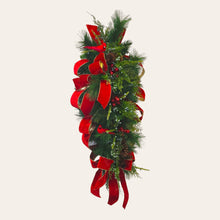 Load image into Gallery viewer, This is a teardrop door hanger festive swag for Christmas season. It has red &amp; blue berries, pinecones, cardinals, and red velvet ribbon.
