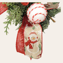 Load image into Gallery viewer, This teardrop door hanging wreath is a festive swag for the Christmas season. It has 2 snowmen, pine, berries, and 2 types of ribbon.
