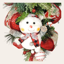 Load image into Gallery viewer, This teardrop door hanging wreath is a festive swag for the Christmas season. It has 2 snowmen, pine, berries, and 2 types of ribbon.
