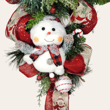 Load image into Gallery viewer, This teardrop door hanging wreath is a festive swag for the Christmas season. It has 2 snowmen, pine, berries, and 2 types of ribbon.
