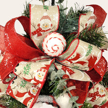 Load image into Gallery viewer, This teardrop door hanging wreath is a festive swag for the Christmas season. It has 2 snowmen, pine, berries, and 2 types of ribbon.
