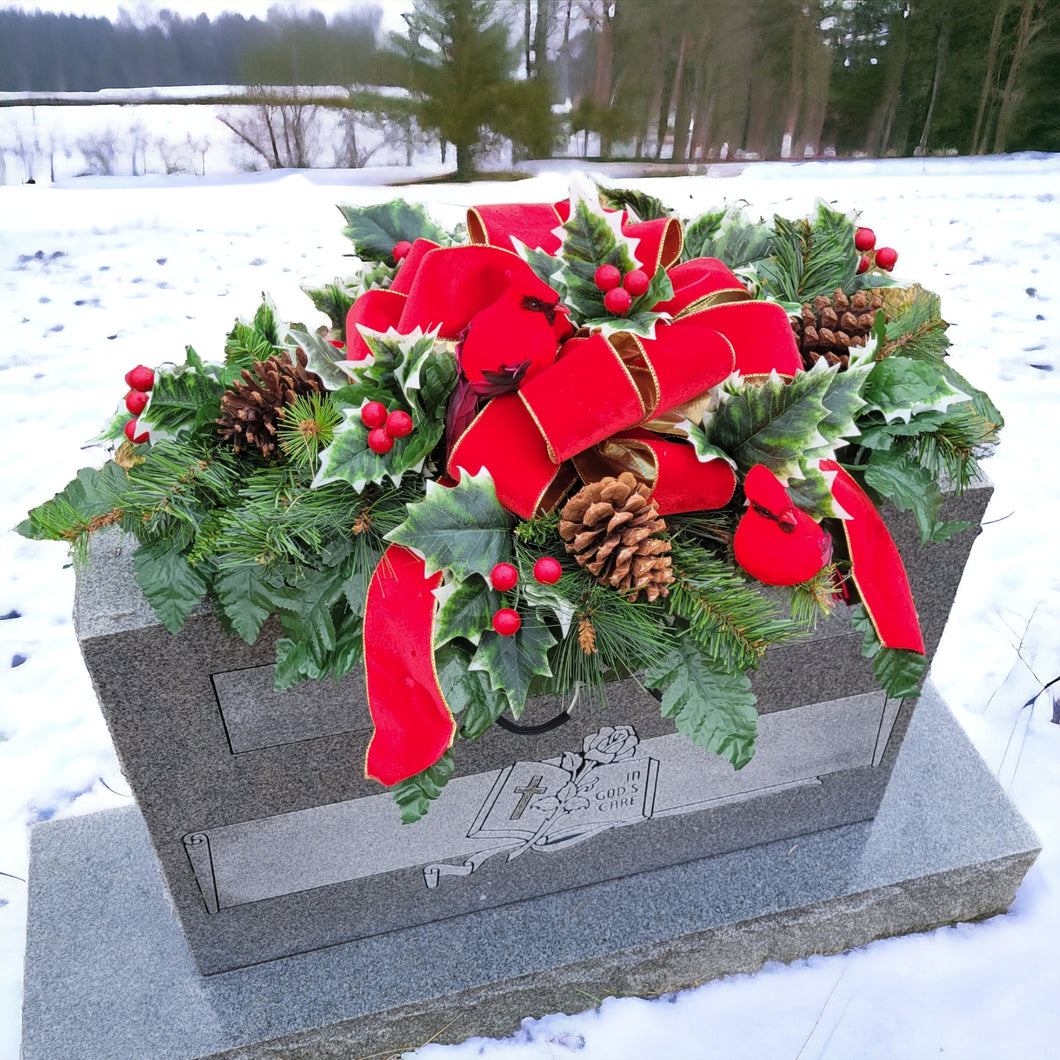 Holly and Cardinal Christmas cemetery saddle has a giant red velvet bow, winter greens, and 2 Red Birds for Winter memorial decorating.