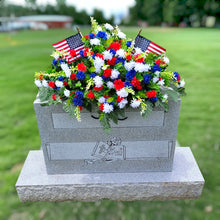 Load image into Gallery viewer, This Headstone Saddle has grave flowers including Red, White, &amp; Blue Mini Mums. It is a perfect Patriotic funeral or cemetery decoration.
