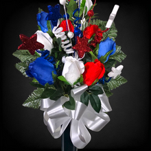 Load image into Gallery viewer, This patriotic memorial cemetery cone pair has grave flowers including red, white, and blue rosebuds and glitter stars.
