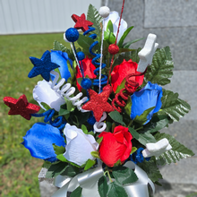 Load image into Gallery viewer, This patriotic memorial cemetery cone pair has grave flowers including red, white, and blue rosebuds and glitter stars.

