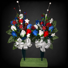 Load image into Gallery viewer, This patriotic memorial cemetery cone pair has grave flowers including red, white, and blue rosebuds and glitter stars.

