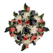 Load image into Gallery viewer, This Stars and Stripes Rosebud cemetery saddle decoration has grave flowers including stars and stripe rosebuds and White Spider Mums.
