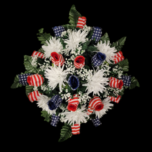 Load image into Gallery viewer, This Stars and Stripes Rosebud cemetery saddle decoration has grave flowers including stars and stripe rosebuds and White Spider Mums.
