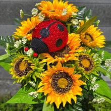 Load image into Gallery viewer, A cemetery cone with grave flowers including yellow sunflowers and a ladybug. This is a memorial decoration or flowers for funeral.
