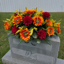 Load image into Gallery viewer, This Headstone Saddle is made with grave flowers including Orange Sunflowers and Burgandy Mums. It's a summer or fall memorial decoration.
