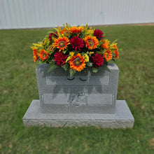 Load image into Gallery viewer, This Headstone Saddle is made with grave flowers including Orange Sunflowers and Burgandy Mums. It's a summer or fall memorial decoration.
